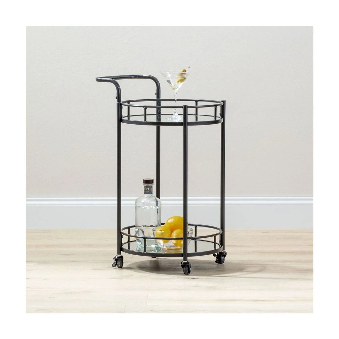 mDesign Metal Vintage Round Beverage Rolling Cart for Home - 2-Tier Serving Bar Trolley with Easy-Glide, Rotating Wheels, Built-in Handle, and Glass Shelves for Wine and Craft Beer - Black Round