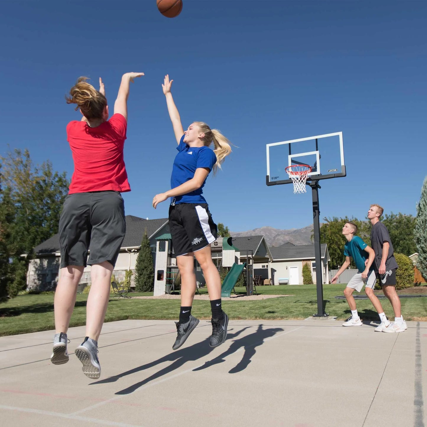 Lifetime 7.5ft. – 10ft. Adjustable Height 60” Tempered Glass Bolt-Down Basketball System (90569)